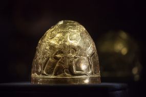 A helmet with the story of the Scythian epic