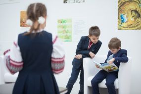 School children examine the textbooks