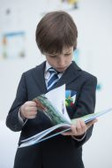 Boy examines the textbook