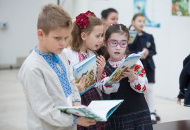 School children examine the textbooks