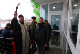 The priest holds the rite of consecration of an apartment house
