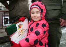 A girl holds a certificate