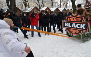 Oleg Skavysh pulling teeth sled with people