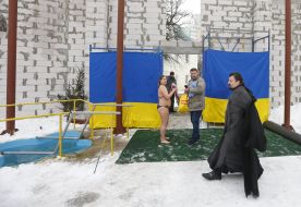 A priest goes to the font