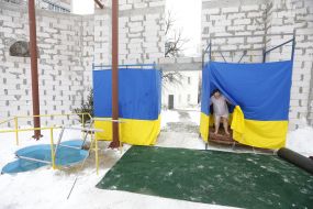 Woman comes out of the locker room before a dip in the font