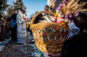 A priest consecrates water