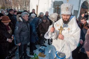 A priest consecrates water