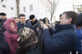 Vladimir Groisman communicates with people