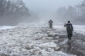 Rescuers blow up the ice on the river