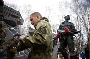 Laying flowers at the monument to soldiers-internationalists