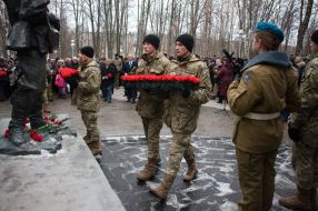Laying flowers at the monument to soldiers-internationalists