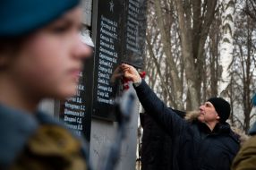 Laying flowers at the monument to soldiers-internationalists