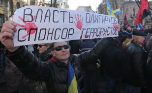 Participants of the meeting holding a poster