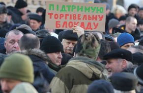 Participants of the meeting holding a poster