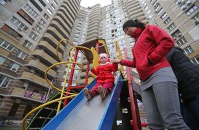 Woman with child at the playground