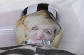 Rubber Doll with a portrait of Gontareva in a coffin
