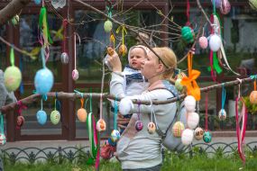 Boy hangs Easter Egg
