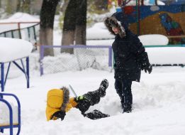 Children play in the snow
