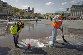 Employees of the municipal service wash of the Postova Ploschad in Kiev