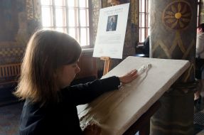 Blind girl touches icons