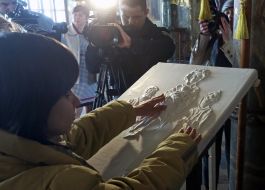 Blind girl touches icons