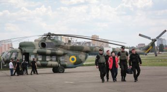 Law enforcement officials accompanying the detained former head of the bus