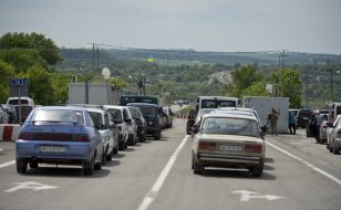 People at the checkpoint of entry and exit "Novotroitskoe"