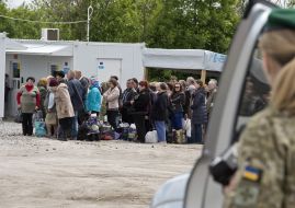 People at the checkpoint of entry and exit "Novotroitskoe"