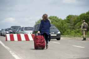 People at the checkpoint of entry and exit "Novotroitskoe"