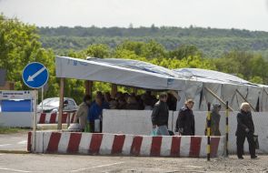 People at the checkpoint of entry and exit "Novotroitskoe"