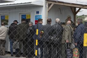 People at the checkpoint of entry and exit "Novotroitskoe"
