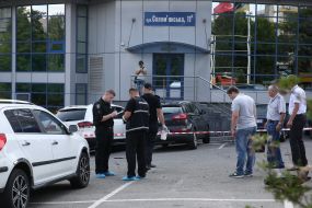 The forensics work at the site of the car explosion