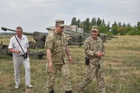 Servicemen near military equipment