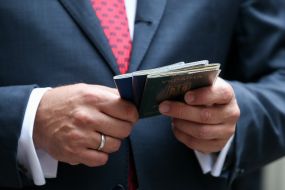 Mikhail Dobkin holds passports in his hands