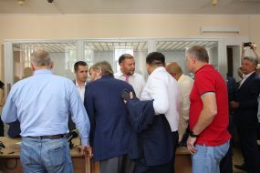 Mikhail Dobkin surrounded by colleagues