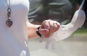 The girl near the art object "Transformation"