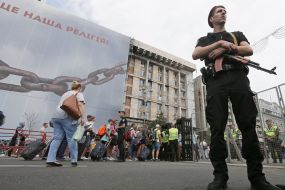 People go through a metal detector frame