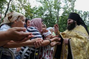 The priest blesses the believers