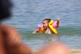 The girl swim in the lake
