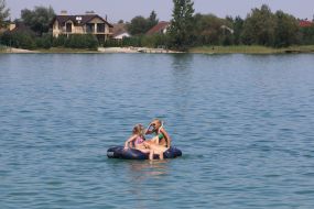 Children swim in the lake