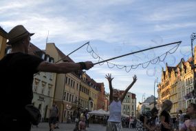 Girl catches soap bubbles