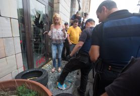 Police near the broken door of the store "Emporium"