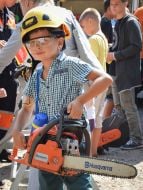 A boy with a chainsaw