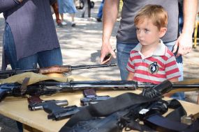 A boy near a firearm