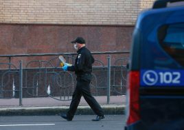 A police officer near the car explosion
