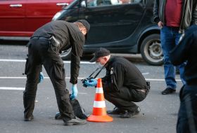 A police officers near the car explosion