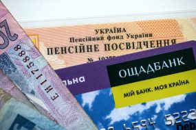 Money and bank card on the pension certificate