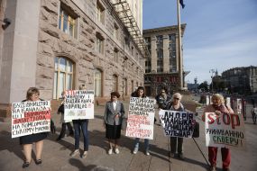 Participants of the flashmob hold posters