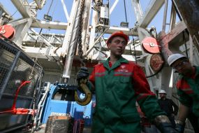 Workers on the platform of the drilling rig