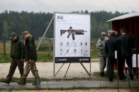 Poster with an image of an automatic carbine